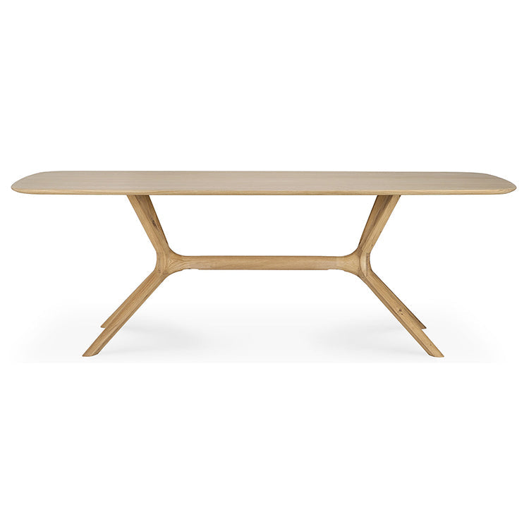 Table à manger minimaliste en chêne massif avec structure pied-plateau intégrée pour salle à manger