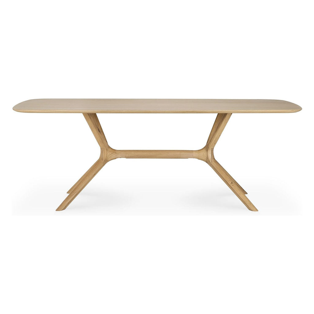 Table à manger minimaliste en chêne massif avec structure pied-plateau intégrée pour salle à manger