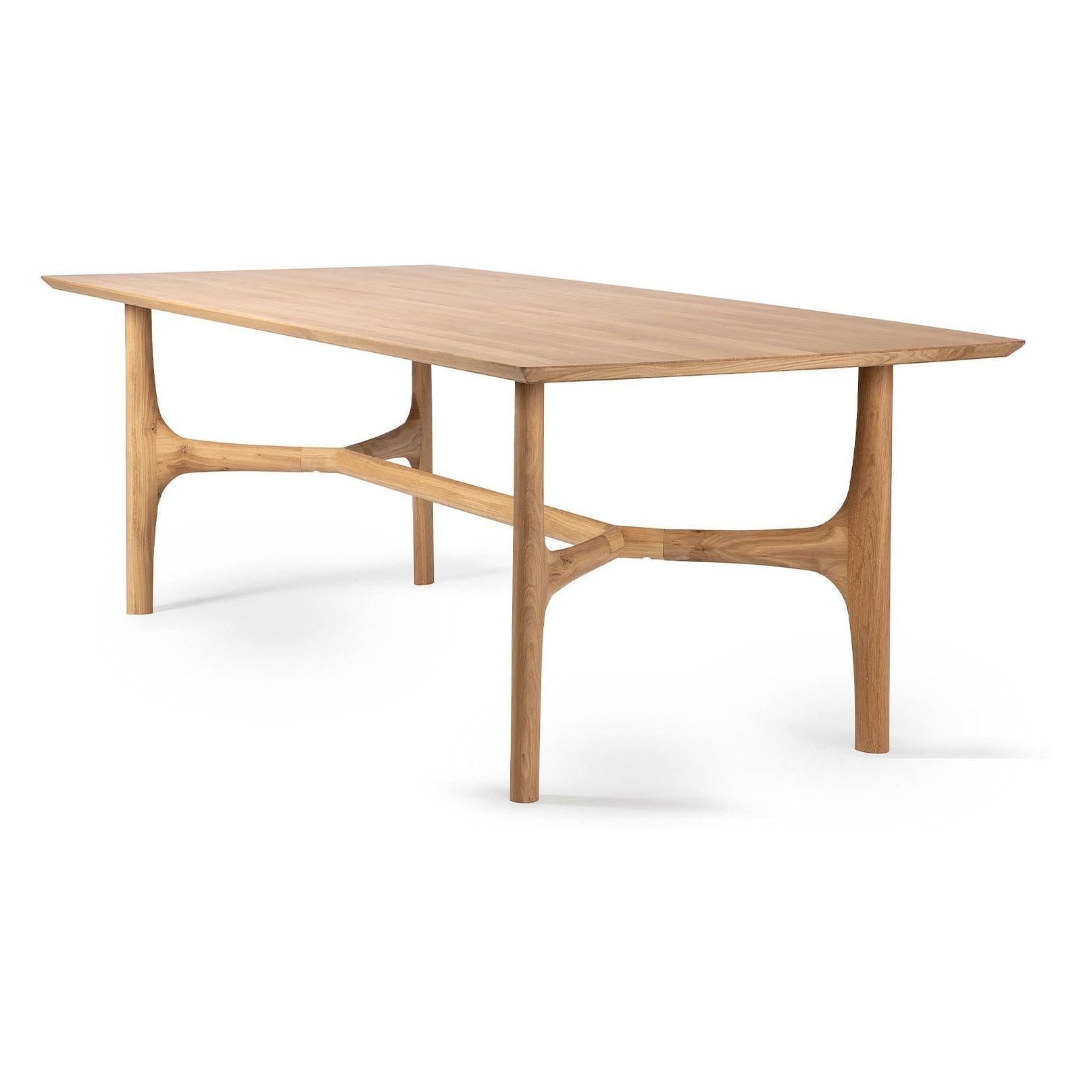 Table de salle à manger contemporaine en chêne massif avec pieds sculptés fluides